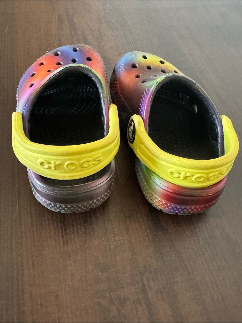 CROCS Kids Rainbow Tie-Dye Clogs with Yellow Heel Strap